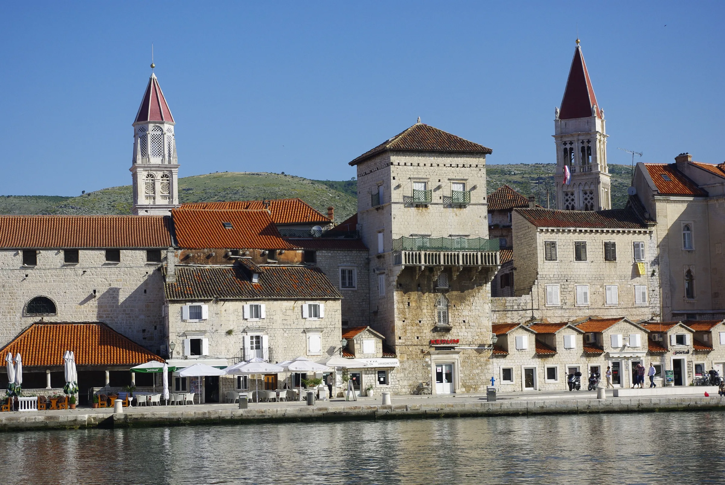 Stone waterfront buildings beside the sea in Trogir